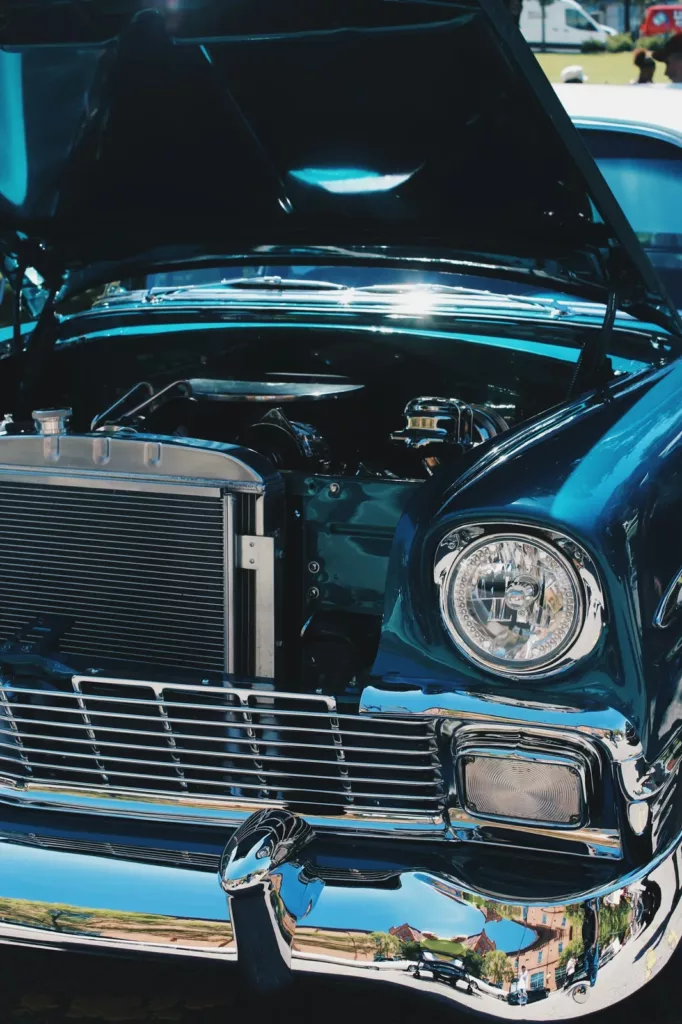 Classic car with the hood open showing the chrome grille and radiator — cooling system service at Rite-Price Auto Service Centre in Calgary, AB